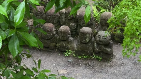 Disciples of Buddha stone statues rakan Otagi Nenbutsu-ji Buddhist temple Stock Footage 344554115