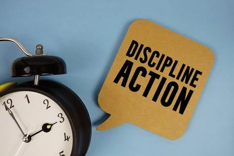 Discipline Action text with alarm clock on blue background Stock Photos