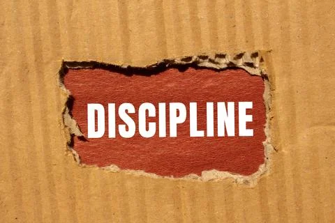 Discipline message written on ripped torn paper background. Conceptual Disc.. Stock Photos
