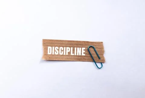 Discipline message written on ripped torn paper background. Conceptual Disc.. Foto stock