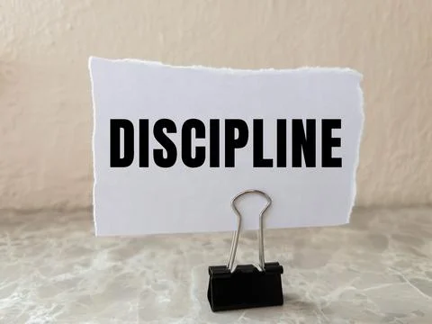 Discipline message written on ripped torn paper background. Conceptual Disc.. Foto stock