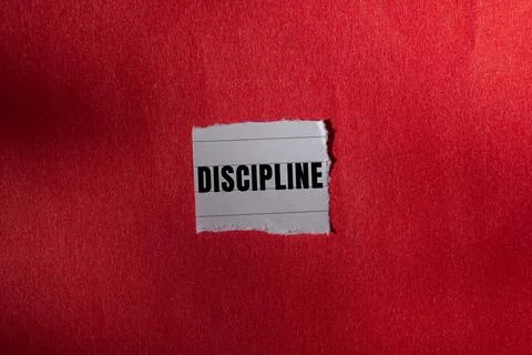 Discipline message written on ripped torn paper background. Conceptual Disc.. Foto stock