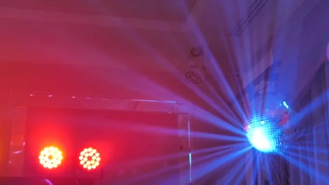Disco ball and LED spotlights with multi-colored beams. Stock Footage 342255987