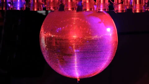 Disco ball with bright rays, night party background. disco ball hanging from the Stock Footage 94472310