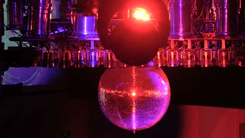 Disco ball with bright rays, night party background. disco ball hanging from the Stock Footage 94472573