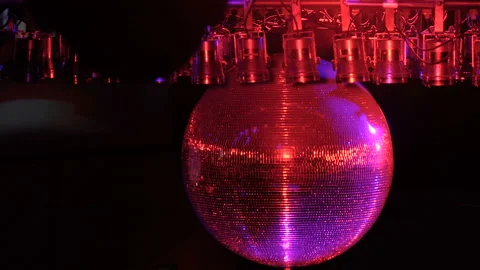 Disco ball with bright rays, night party background. disco ball hanging from the Video stock 94472790