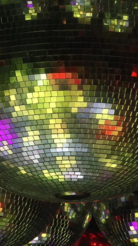 Disco ball creates vibrant atmosphere at lively party in dark room Stock Footage 276282380