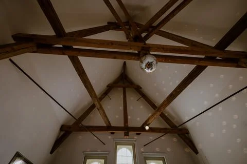 Disco ball lamp on the ceiling in the building Stock Photos