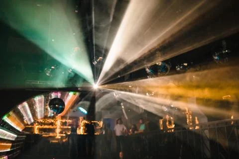 Disco ball light reflection in a night out with people Stock Photos