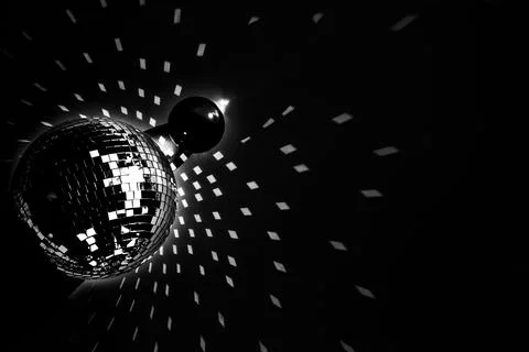 Disco ball light reflections on a dark background Stock Photos
