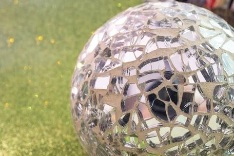 Disco ball made from irregular mirror shards, abstract backdrop,  soft focu.. Stock Photos
