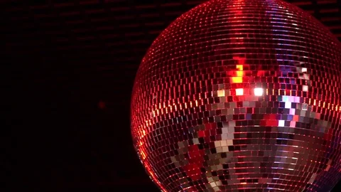 Disco ball mirror rotates and sparkles in different colors Stock Footage 72207555