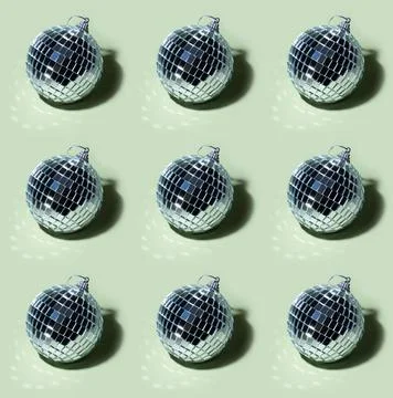 Disco ball pattern on basil green background Stock Photos