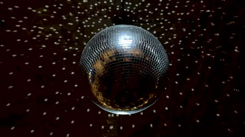 Disco Ball with Reflected Moving Rays Rotating. Mirror disco ball in white light 動画素材 322052666