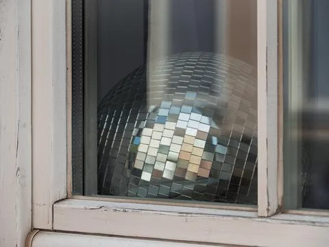 Disco Ball Reflected in a Window Pane Stock Photos