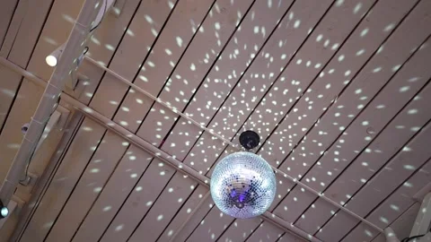 The disco ball rotates and reflects beautiful light. Nightclub, party Stock Footage 153490653