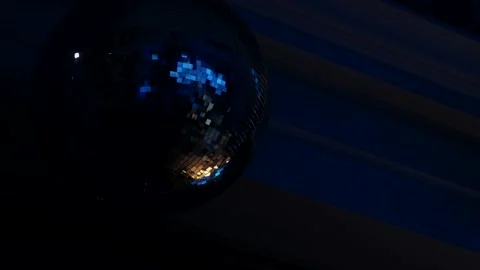 Disco ball rotates. Close-up. Mirror ball spinning and making club lasers indoor Stock Footage 261509275