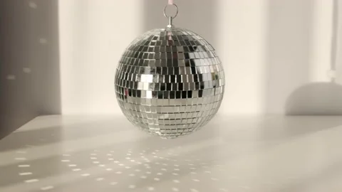 Disco ball rotates with shadows and casts rays of bright ligh Stock Footage 170965958