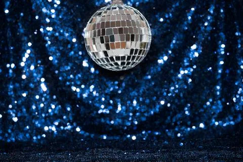 Disco ball on sequin background Foto stock