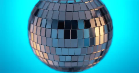 Disco ball spinning in blue background closeup view. Stock Footage 146174033