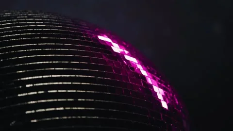 The disco ball spins and casts neon light and reflections. Close-up shooting Stock Footage 260718115