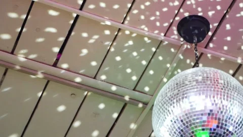 Disco ball spins at a party. Reflections from rays Stock Footage 154110237