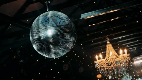 Disco ball spins in the rays of light Stock-Footage 309497953