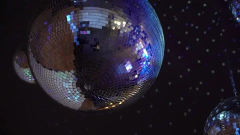 A disco ball suspended from the ceiling ... | Stock Video | Pond5