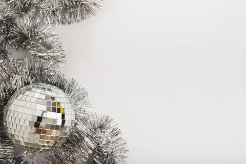 Disco ball with tinsel on white table Stock Photos