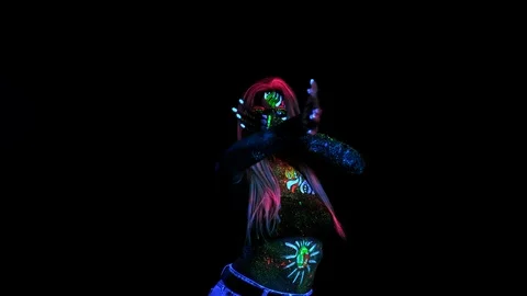 Disco Dancer in Neon Illumination Lights with Painted Skin and Bright Eye UV Stock Footage 124586856