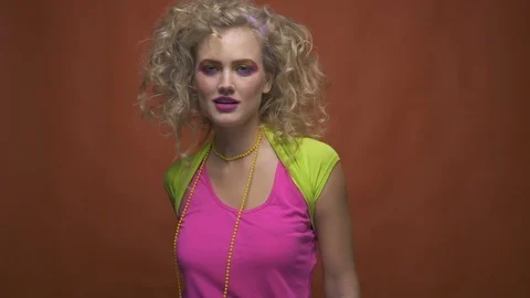 Disco diva seductively luring and licking her teeth, slow motion Stock Footage 97641696