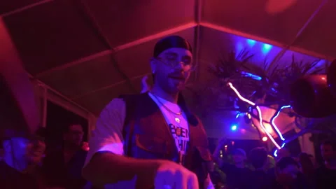 Disco Dj playing music at intimate nightclub party. Stock Footage 337902881