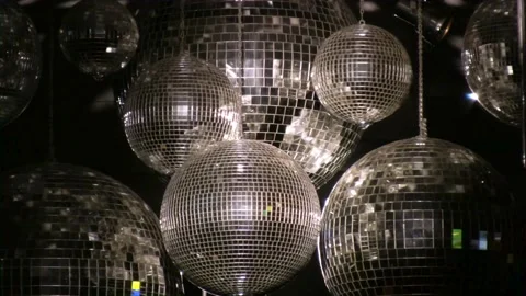 Disco party balls on ceiling. Background of several disco balls in a nightc.. Stock Footage 265755489