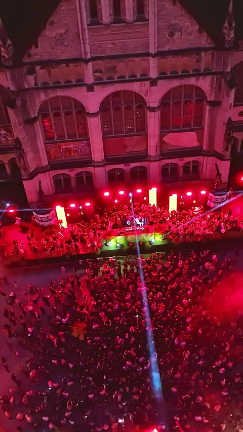 A disco party with a crowd of people on the dance floor at night. Bright beams Stock Footage 321781859