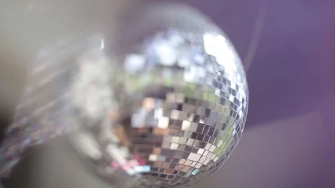 Discoball in blur in the violet rays and the glare of the sun Stock-Footage 95334665