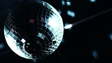 Discoball mirrorball spinning reflecting light into a club venue Stock Footage 52056554