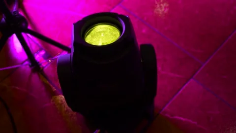 Discolight in darkness with colorful auto rotating RGB projector led. Nightclub Stock Footage 166385454