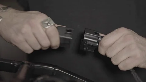 Disconnecting a electrical connector Stock Footage 125445745