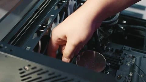 Disconnecting power cable of liquid cooling system inside PC case Stock Footage 328982932