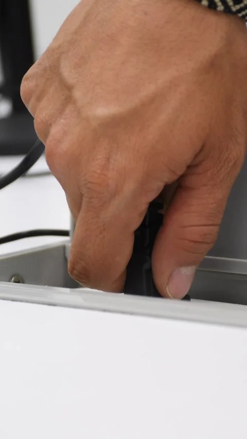 Disconnecting Power Cable from NEMA Plug, Removing Electrical Cord from Outlet Stock Footage 300600231