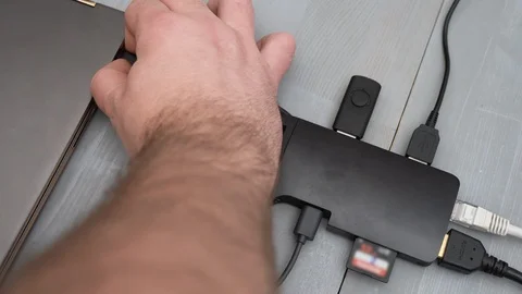 Disconnecting USB Type C adapter or hub from the laptop. Video stock 124020771