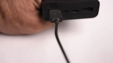 Disconnecting USB Type A Cable from Power Bank Stock Footage 340610947