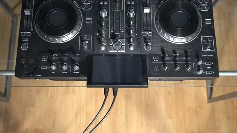 Disconnecting XLR and power cable to DJ mixer (Aerial) Stock Footage 201984314