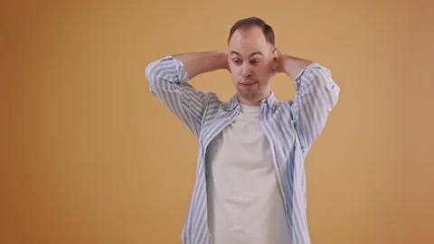 Discontented man gestures hands on back of his head with failure emotion Video stock 289105296
