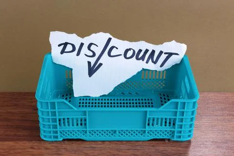 Discount word  in a empty plastic crate Foto stock