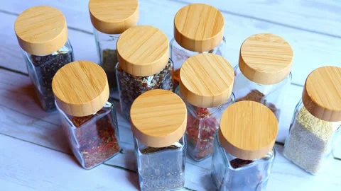 Discover array of spice jars meticulously organized for storage. Explore diverse Stock Footage 268241420