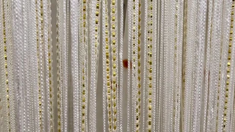Discover the beauty of Elegant String Art and Decorative Hanging Curtains for Stock Footage 304835176