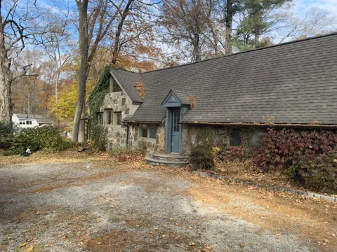 Discover a Charming Stone Cottage Surrounded by Autumn Beauty Stock Footage 316790775
