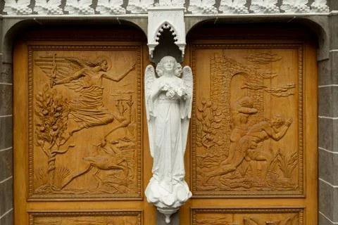 Discover the exquisite craftsmanship of a beautifully carved wooden entrance Stock Photos