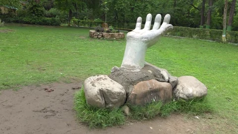 Discover the Hand Statue in the Park Stock Footage 313564583